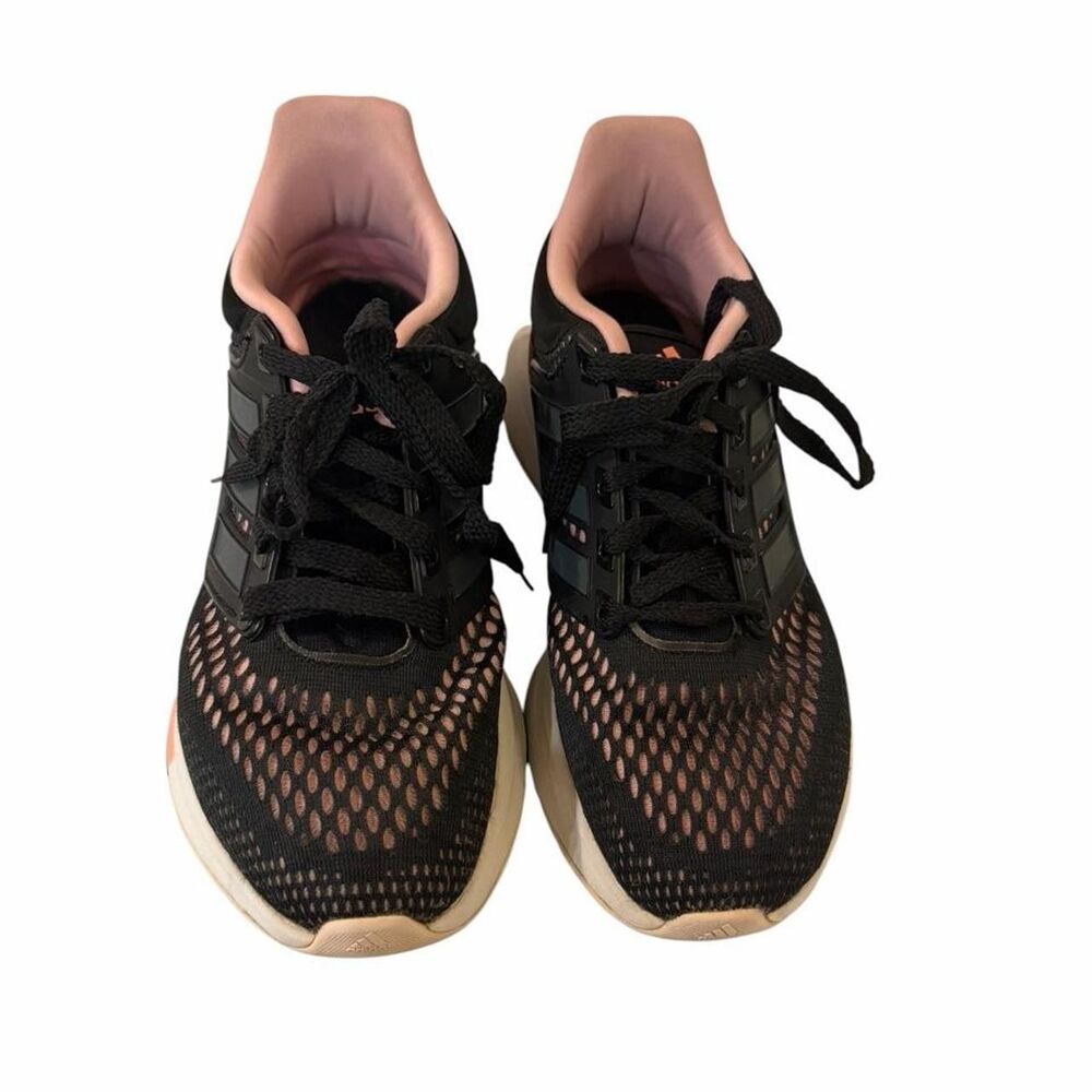 Adidas black running shoes with pink accents